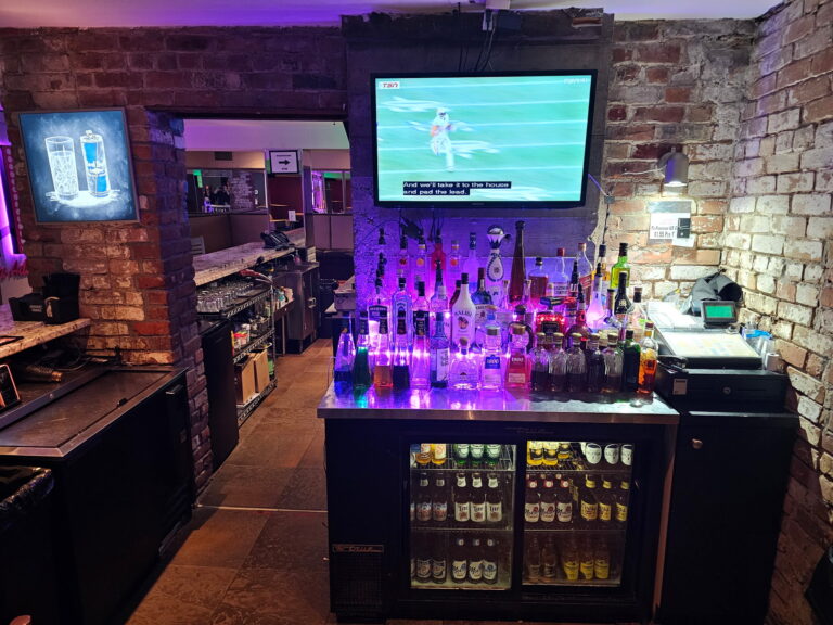 Bar area with exposed brick walls at Alley Katz Windsor