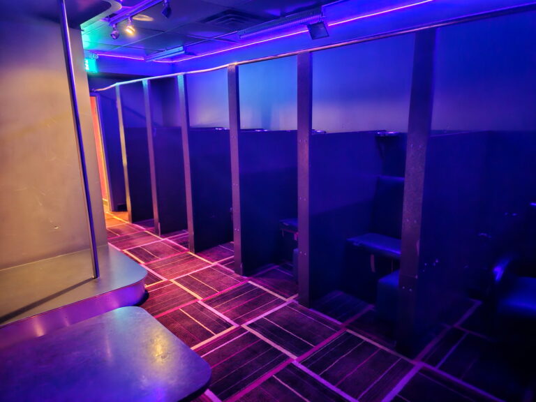 Private booth seating under purple lighting at Alley Katz Windsor