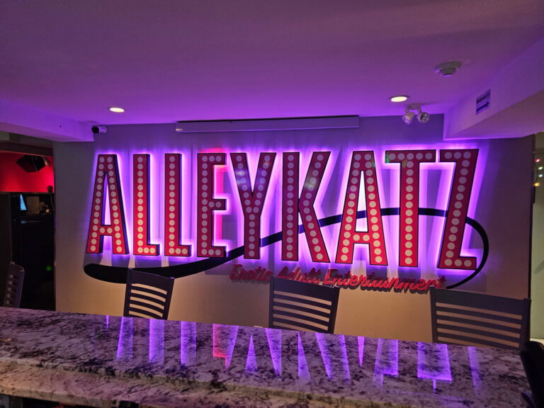Illuminated Alley Katz sign inside the Windsor venue